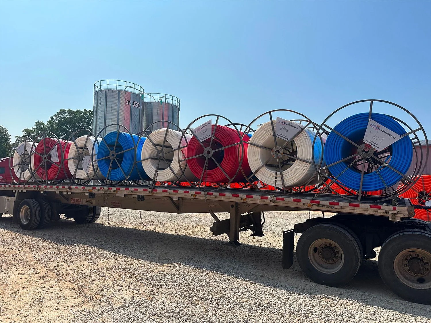 A truck carrying reels of conduit by bulldog pipe manufacturer that are about to be delivered to suppliers.