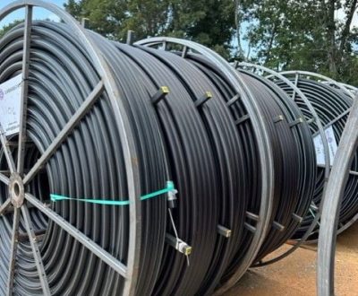 A reel of black HDPE Conduit hoses.